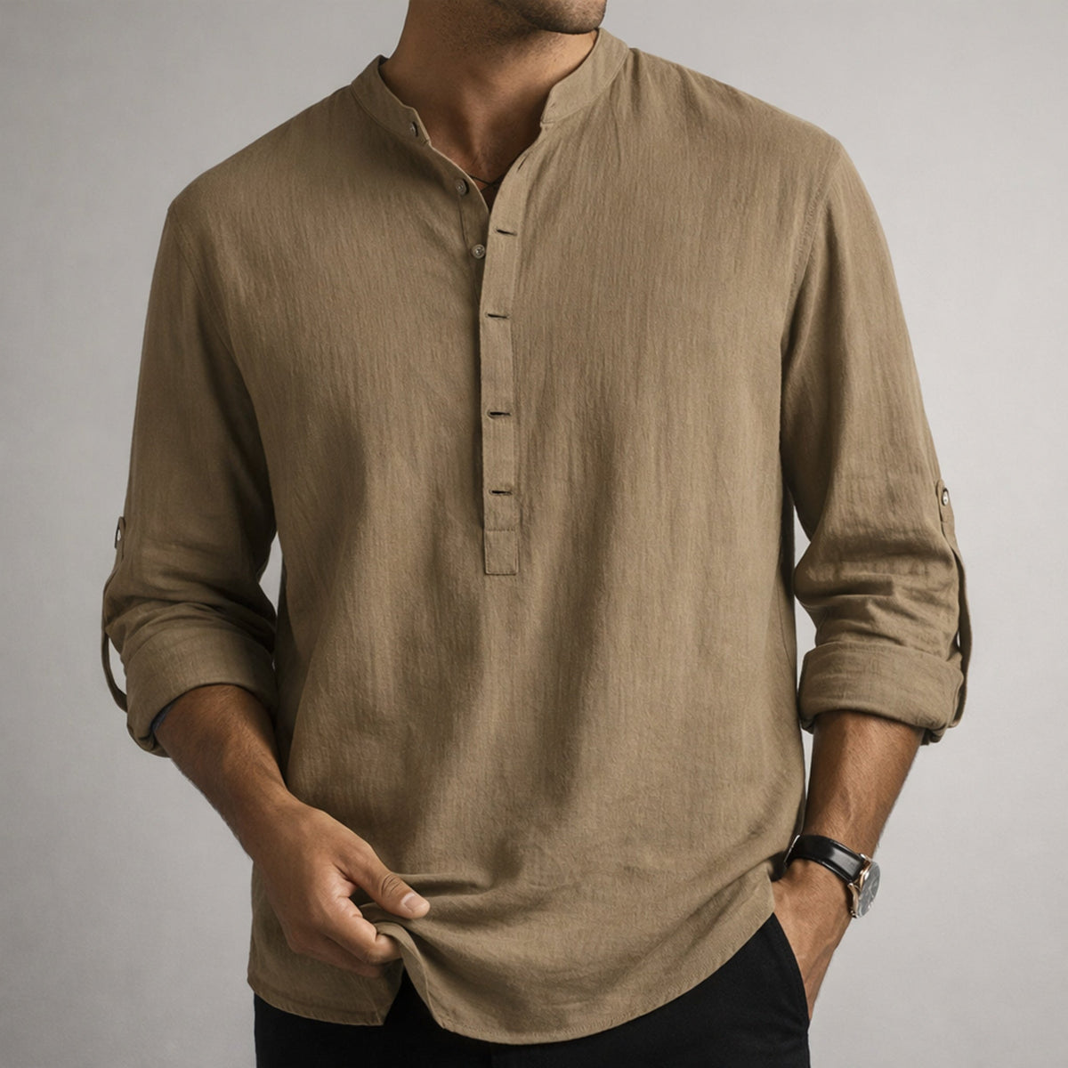 Man in a tan grandad-collar shirt
